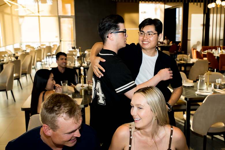 Guests connecting after a Tom Talks event